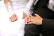 Bride and groom holding hands