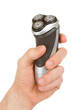Hand holding an electric shaver