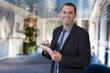 Businessman using digital tablet in office