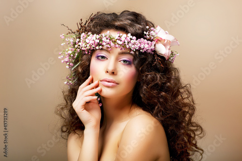 Photo: Complexion. Classy Young Woman with Curly Hairdo - Blush Face Complexion. Classy Young Woman with Curly Hairdo - Blush Face