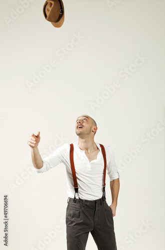 Photo: man throws his hat in air man throws his hat in air