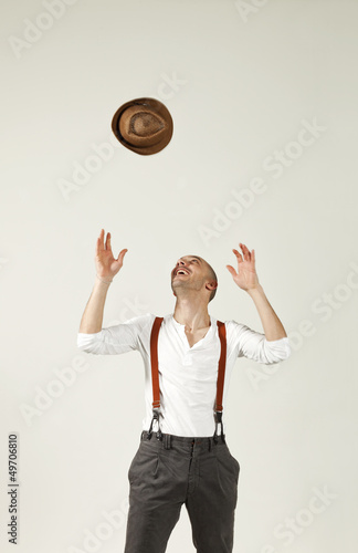 Photo: man throws his hat in air man throws his hat in air