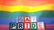 Rainbow flag moving in the breeze with gay pride blocks