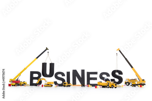 Photo: Build up a business: Machines building business-word. Build up a business: Machines building business-word.