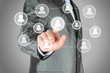 Businessman with hand pressing virtual social media button