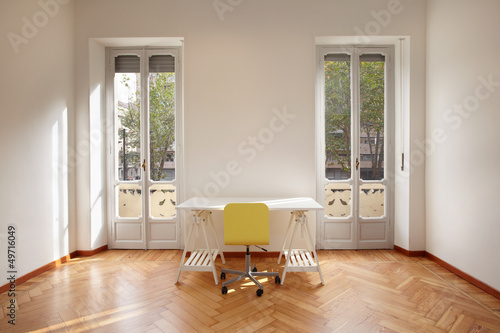 Photo: Modern new apartment room with desk Modern new apartment room with desk