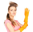 housewife with protective gloves