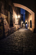 narrow alley with lanterns in Prague at night