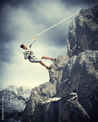 Photo: businesswoman climbing mountain businesswoman climbing mountain