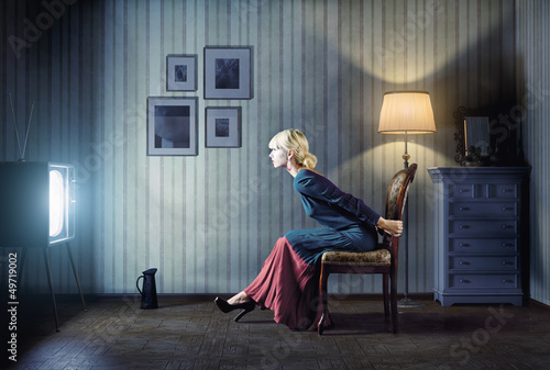 Photo: woman watching tv woman watching tv