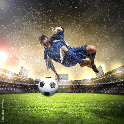 Photo: football player striking the ball football player striking the ball