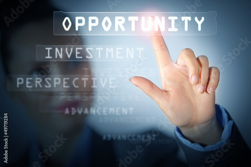 Photo: Business woman touching display Business woman touching display