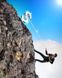 busiessman climbing mountain