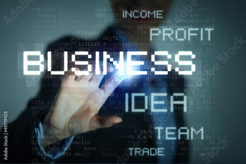 Photo: Business woman touching display Business woman touching display