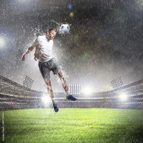Photo: football player striking the ball football player striking the ball