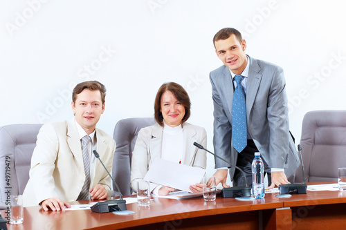 Photo: Three businesspeople at meeting Three businesspeople at meeting