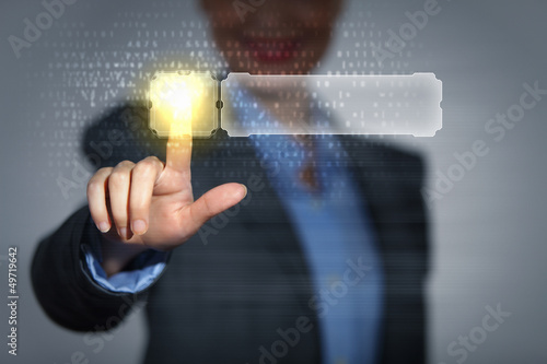 Photo: Business woman touching display Business woman touching display