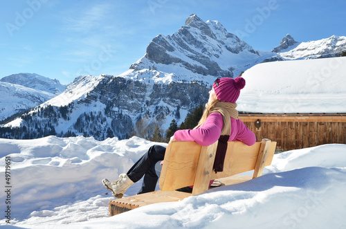Photo: Traveler enjoying Alpine panorama. Switzerland Traveler enjoying Alpine panorama. Switzerland