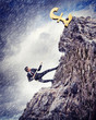 busiessman climbing mountain
