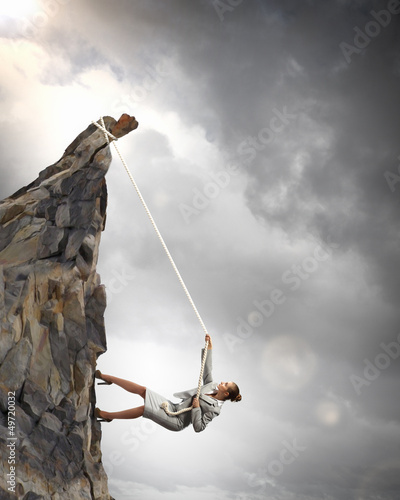 Photo: businesswoman climbing mountain businesswoman climbing mountain