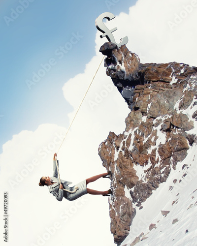 Photo: businesswoman climbing mountain businesswoman climbing mountain
