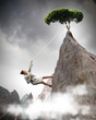 businesswoman climbing mountain