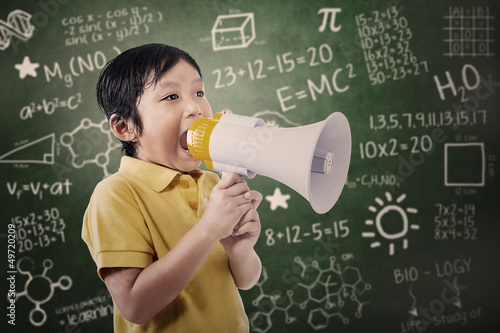 Photo: Boy student announce using speaker Boy student announce using speaker