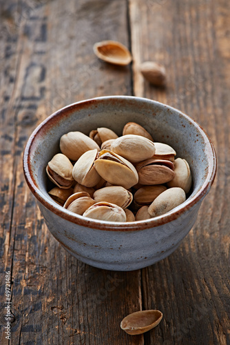 Photo: Pistachios in a small ceramic bowl Pistachios in a small ceramic bowl