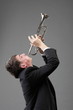 Portrait of a young man playing his Trumpet