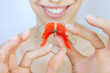 smiling girl with retainer on teeth