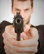 Man with a gun ready to shoot