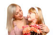 Mother and daughter with flowers looking at each other isolated