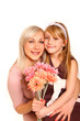 Hugging mother and daughter with flowers isolated on white