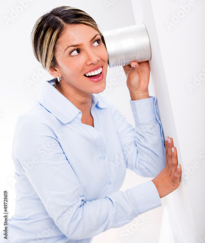 Photo: Businesswoman listening to secrets Businesswoman listening to secrets