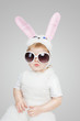 Boy wearing a bunny rabbit costume and sunglasses