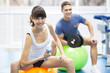 Cheerful young couple in a gym
