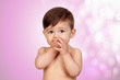 Adorable baby girl with the hands in her mouth
