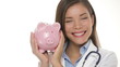 Medical doctor holding piggy bank money concept
