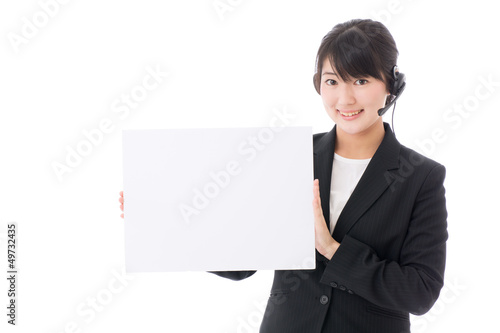 Photo: a young businesswoman with whiteboard a young businesswoman with whiteboard