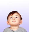 Surprised baby girl looking up