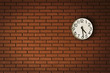 clock on brick wall