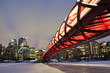 Calgary skyline and peace bridge at night.