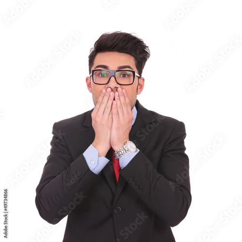 Photo: business man covering mouth business man covering mouth