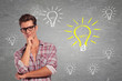 Young Man with glasses Having many Ideas