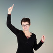 Woman stretched index finger in the air and looking forward