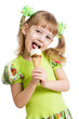 happy kid girl eating ice cream in studio isolated