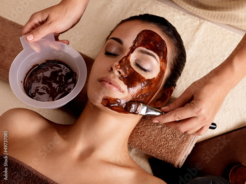 Photo: Spa therapy for woman receiving cosmetic mask Spa therapy for woman receiving cosmetic mask