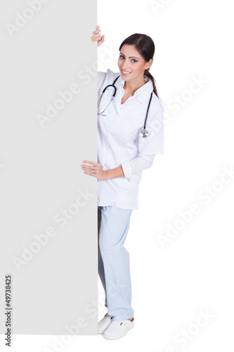 Photo: Happy Female Doctor Holding Placard Happy Female Doctor Holding Placard