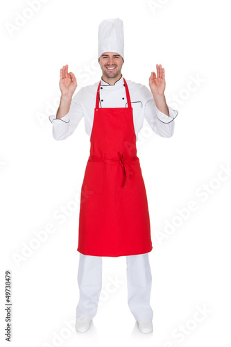 Photo: Portrait of cheerful chef in uniform Portrait of cheerful chef in uniform