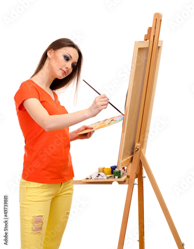 Photo: beautiful young woman painter at work, isolated on white beautiful young woman painter at work, isolated on white